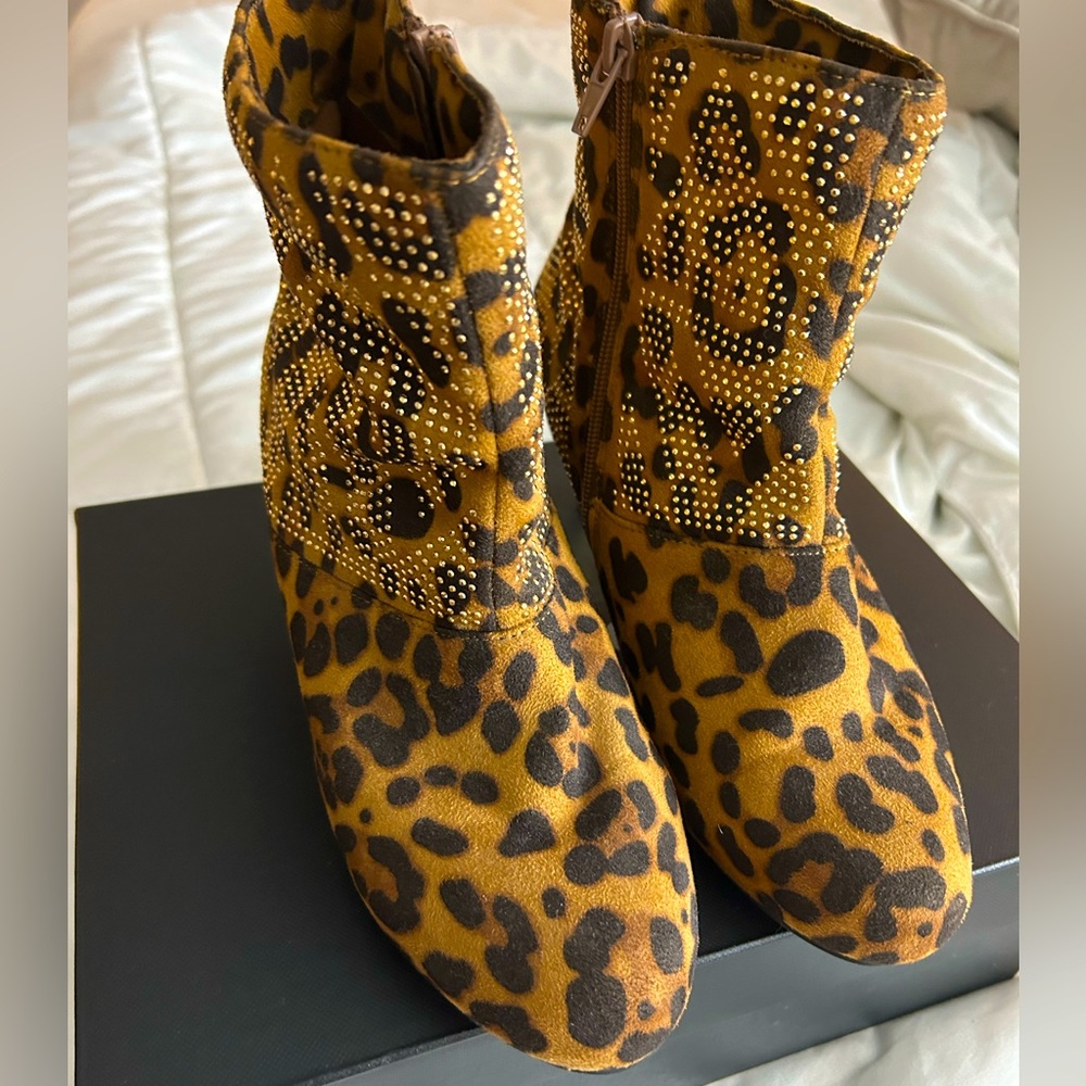 Leopard print kitten heel  ankle booties with gold detail.
